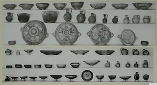 Pottery vessels from Amathus Tomb 7, third burial, arranged in rows on shelves.