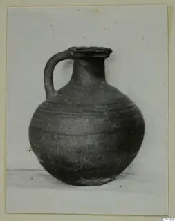 Round jug from Amathus, Tomb 20, with a single strap handle and horizontal bands around the body
