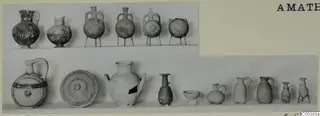 Pottery vessels from Amathus Tomb 25: two rows of jugs, jars and bowls against a pale background