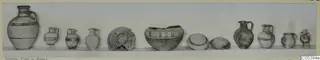 Row of about a dozen pottery vessels from Amathus, Tomb 24, set out along a shelf