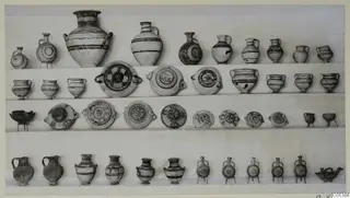 Pottery vessels from Tomb 22 at Amathus, arranged in four rows on a pale background