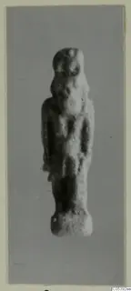 Small standing figurine from Amathus, photographed upright against a plain grey background.