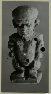 Small stone figure with a flat-topped head, bent arms and a rectangular base, from Pateke, Amathus series