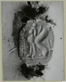 Impression of a scarab from Tomb 62 at Marion, showing raised figures in an oval field