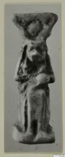 Small standing figure with a broad flat-topped headdress, labelled Hator, from Marion Tomb 50