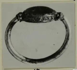 Ring with a broad oval bezel from Marion, photographed on a card mount