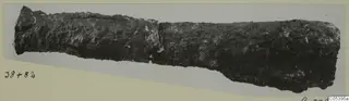 Corroded metal find from Amathus, a long tube-like object with a break near the middle