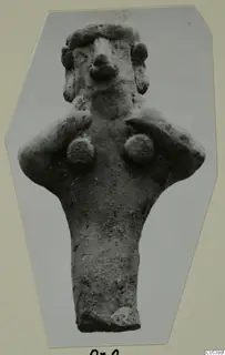 Terracotta figurine from Marion, Tomb 28: a standing figure with bent arms and hands near the breasts