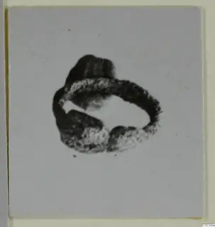 Silver ring-shaped find, thick band with a lump on top and a break on one side