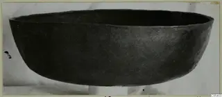 Dark wide bowl from Marion, seen from the side against a pale background.