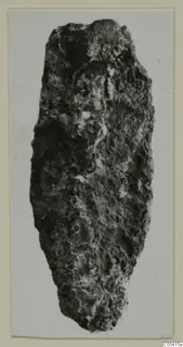 Heavily corroded, elongated find from Amathus, broad at the top and tapering to a rounded end.