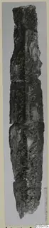 Corroded iron dagger from Amathus, shown upright against a grey background.