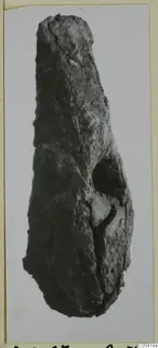Corroded iron tool from Amathus, long and narrow, with a socket-like opening on one side.