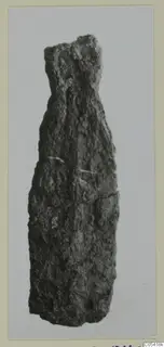 Corroded iron weapon part from Amathus, shown upright against a plain grey background