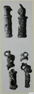Several small corroded silver objects with loops and knobbed or hooked ends, finds from Marion