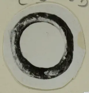 Ring from Marion, shown face-on on a small round print mounted on a cream card.