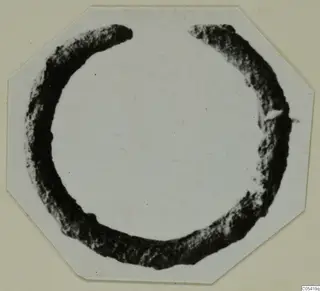 Bronze ring from Marion, incomplete, with a gap at the top where the two ends are broken off.