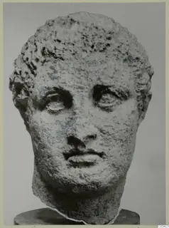 Stone head from Mersinaki with short curly hair and large heavy-lidded eyes