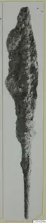 Heavily corroded iron weapon, shown upright against a pale grey background.