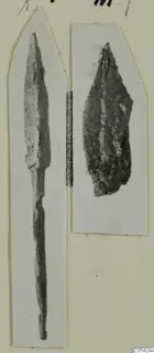 Two iron weapon fragments from Marion mounted side by side on a card: a long pointed blade with a tang and a corroded broad blade.