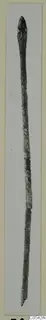 Long slender bronze pin from Marion, photographed against a pale background
