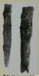 Two corroded iron tools from Marion, long and tapering, shown side by side.