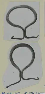 Two bronze loop-shaped mountings with curled ends, from Marion