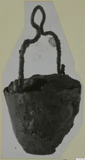 Corroded metal lamp with a looped wire handle, cut-out photograph pasted on a pale green card