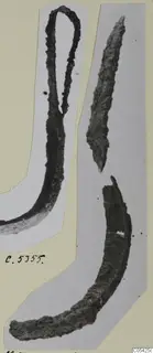 Three corroded iron tool fragments from Marion, one with a looped upper end, on grey mounting card