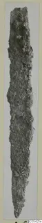 Heavily corroded iron knife blade from Marion, shown upright.