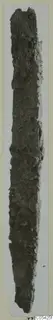 Long, narrow, heavily corroded iron tool from Marion, standing upright
