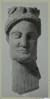 Carved limestone head of a statue from Mersinaki, with a ridged headdress and a fragment of drapery below