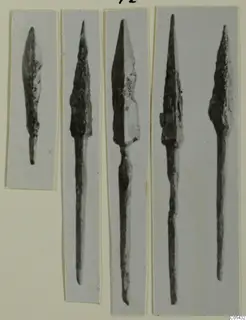Five bronze weapon points, each photographed in a separate strip, mounted together on a card