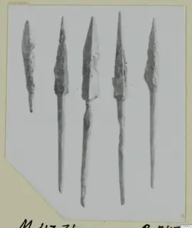 Five bronze arrowheads from Marion, tombs 31–45, shown in a row
