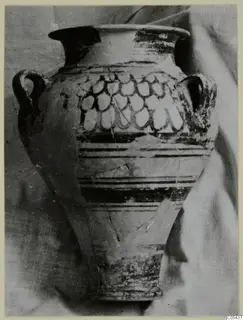 Two-handled jar with a flared rim, banded lower body and a row of pendent loops painted on the shoulder.