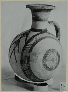 Pottery White Painted II jug with a flaring neck, single handle and dark painted bands and lattice panels