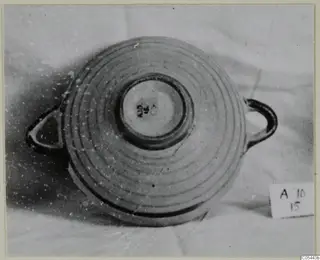 Two-handled pottery bowl seen from above, with concentric grooves on its body, from Amathus