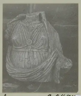 Stone statue fragment from Arsos: a headless torso with pleated drapery and a belt