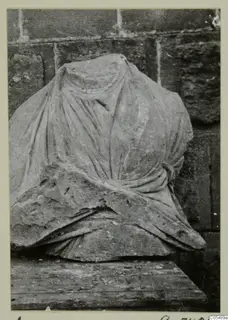 Stone statue from Arsos: a headless draped figure in carved stone