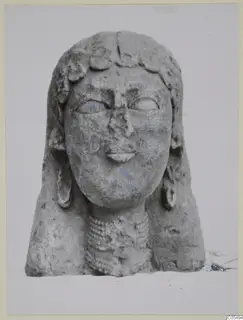 Limestone Proto-Cypriote sculpture of a head and upper body with traces of blue paint