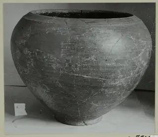 Pottery vessel with a wide mouth, rounded body and short foot, cracked and mended, from Amathus