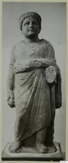 Standing draped statue from Mersinaki, shown on a square base against a plain grey backdrop