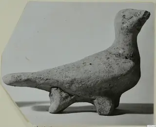 Terracotta figurine of an animal from Marion, shown in profile with a long tapering projection and raised head