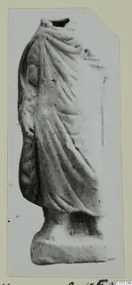 Small draped standing figure with its head missing, on a rectangular base, from Mersinaki