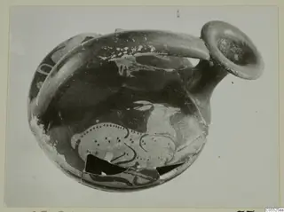 Red-figured pottery vessel with a strap handle and a painted animal on the body, from Marion