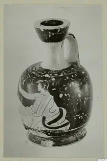 Jug with a rounded body and strap handle, with a figure painted in profile on its side
