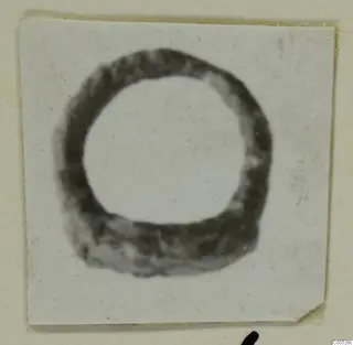 Ring-shaped object from Marion, shown on a small mounted print