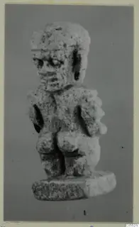Small stone figurine of a standing figure on a flat base, from Amathus tomb group