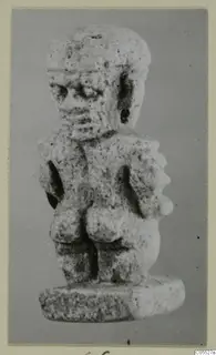 Small pitted stone figurine of a standing figure on a thick oval base, from Amathus
