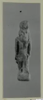 Small standing figurine labelled Thoth, photographed on a grey backdrop